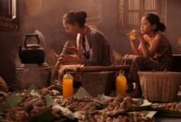 Seorang wanita tengah meracik ramuan obat tradisional Sunda dengan bahan-bahan alami, menunjukkan kearifan lokal yang diwariskan turun-temurun. Proses ini menggambarkan dedikasi dalam melestarikan praktik pengobatan nenek moyang untuk kesehatan dan kesejahteraan.